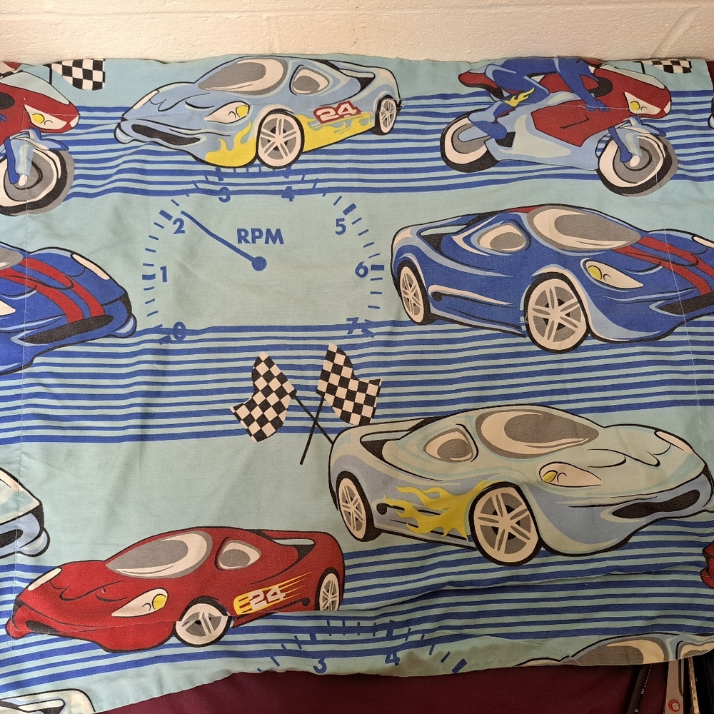 Racecars on a standard size pillowcase.